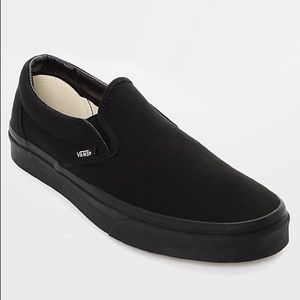 All black Vans slip-ons